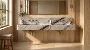 60-inch Lilac marble floating double sink in a travertine bathroom